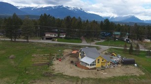 '4 Season Solar Greenhouse Connected to a Passive Solar Home'