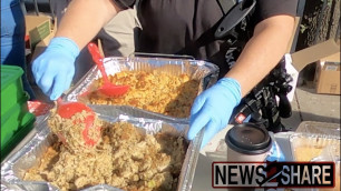 'Armed \"Don\'t Comply\" activists give food, clothes to homeless in Dallas'